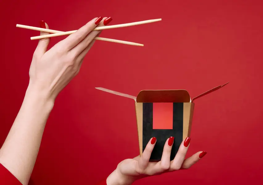 Woman holding chopsticks