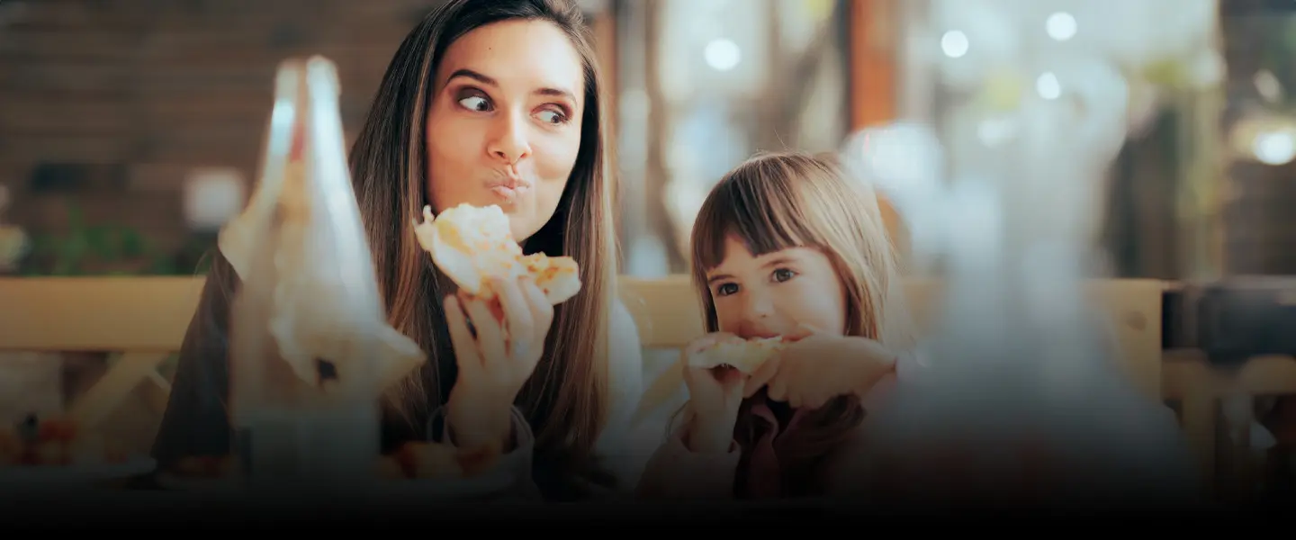 Mom and daughter having food